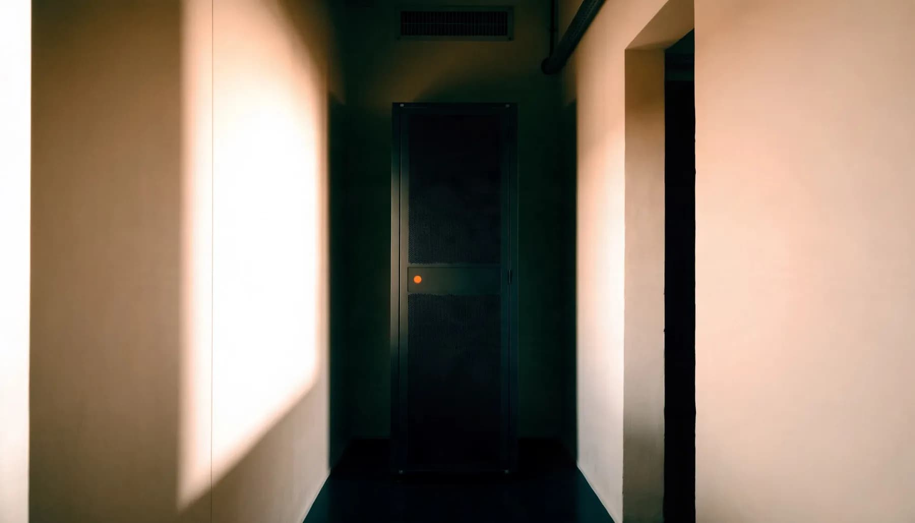A single server rack in a quiet data centre hall